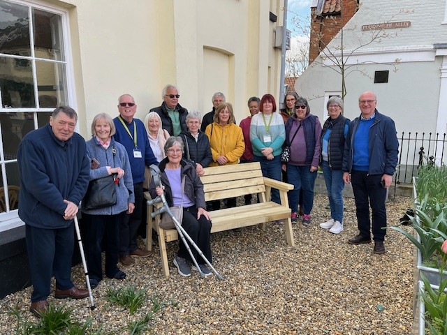 People gathered around a bench