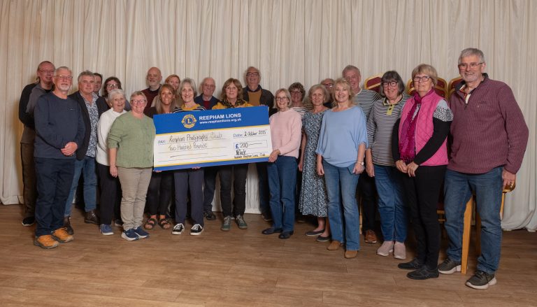 Group of people during a cheque presentation