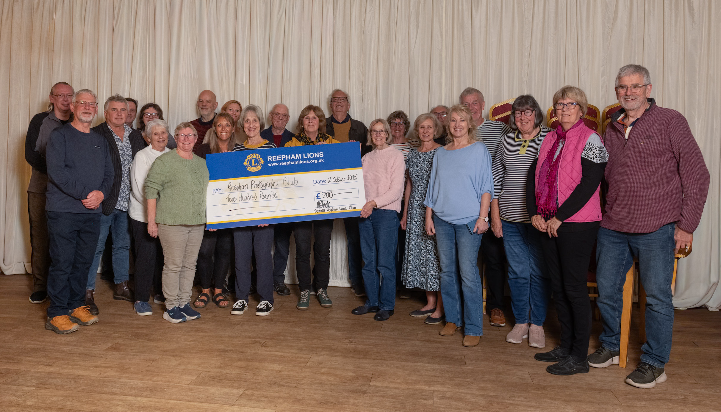 Group of people during a cheque presentation